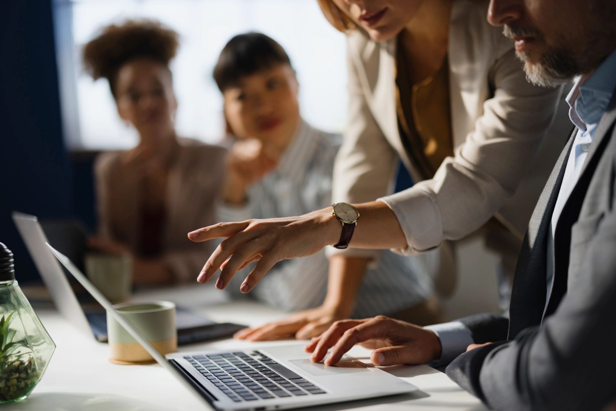 Marketing professionals collaborating at a computer